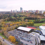 Oliver's apartment towers rising above the river valley and the Royal Glenora Club